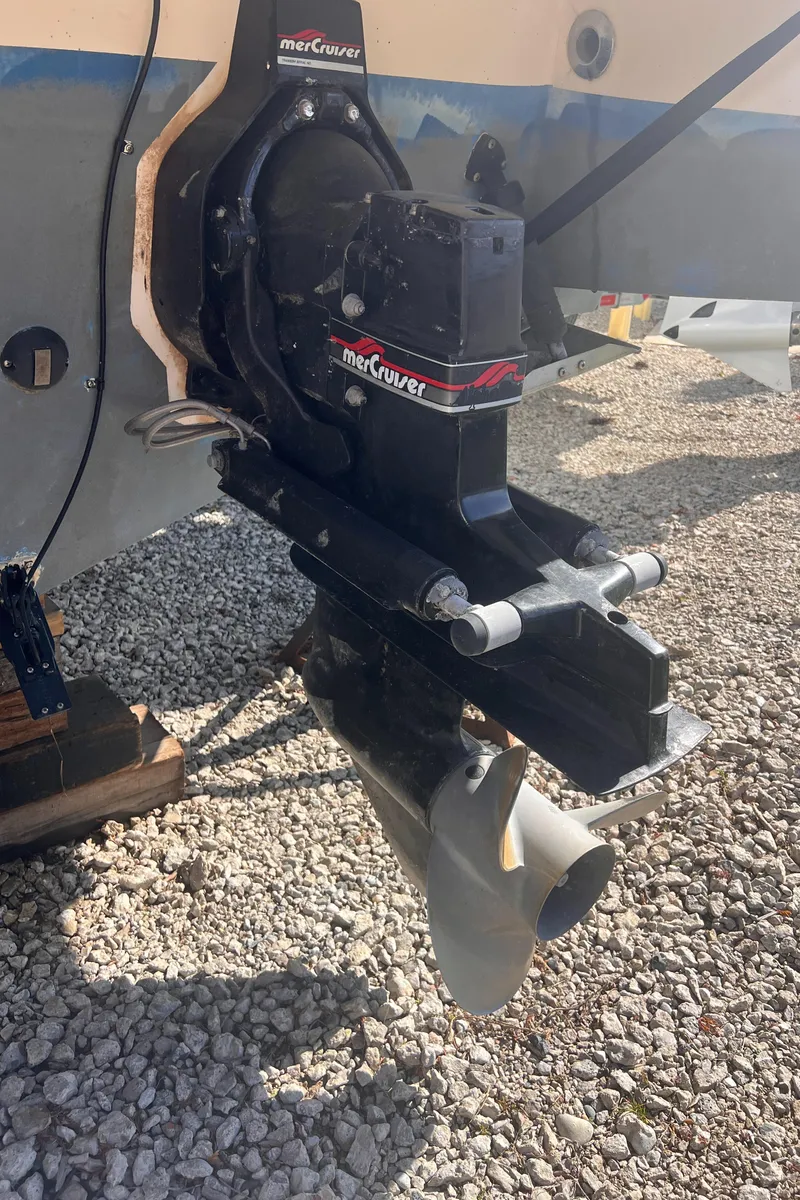 Slide: The Image of 1998 Chaparral 270 Signature boat with MerCruiser outdrive on gravel surface. - 19