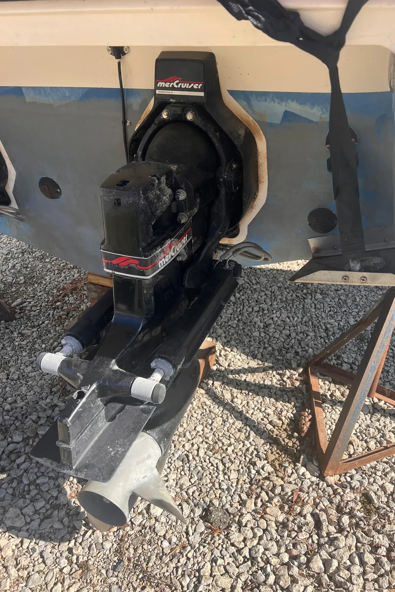 Slide: The Image of 1998 Chaparral 270 Signature boat with MerCruiser outdrive on gravel surface. - 20