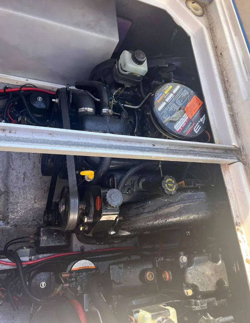 Slide: The Image of Engine compartment of a 1998 Chaparral 270 Signature boat, showing mechanical components. - 21