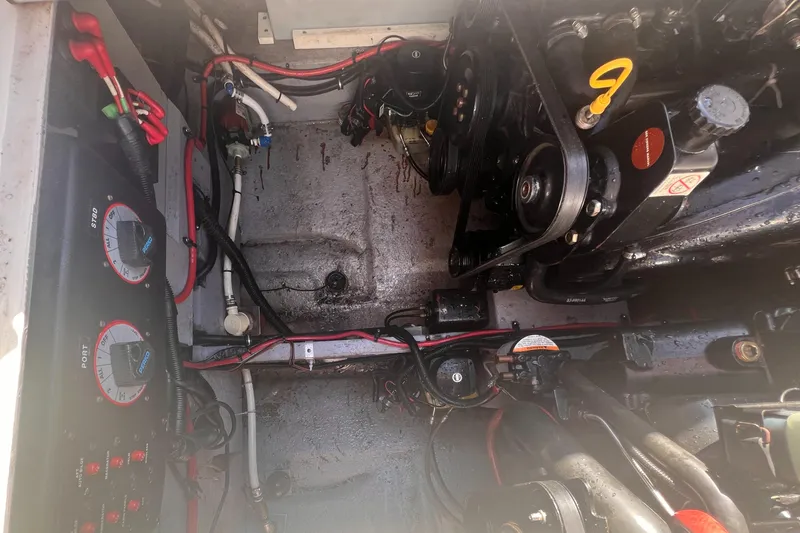 Slide: The Image of Engine compartment of a 1998 Chaparral 270 Signature boat, showing wiring and mechanical components. - 25