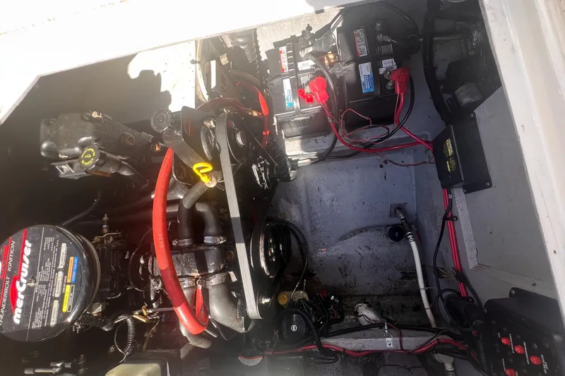 Slide: The Image of Engine compartment of a 1998 Chaparral 270 Signature boat, showing battery and wiring. - 26