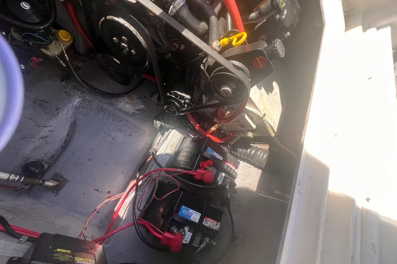 Slide: The Image of Engine compartment of a 1998 Chaparral 270 Signature boat, showing battery and wiring. - 33