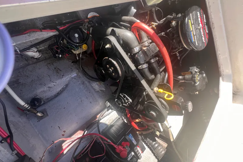 Slide: The Image of Engine compartment of a 1998 Chaparral 270 Signature boat, showing mechanical components and wiring. - 34