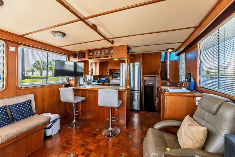 Slide: The Image of Interior of 1992 DeFever 49 Pilothouse with modern kitchen and seating area. - 3