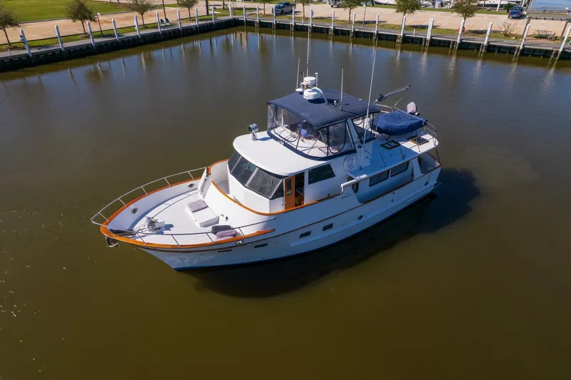 Slide: The Image of 1992 DeFever 49 Pilothouse yacht on calm water, aerial view. - 43