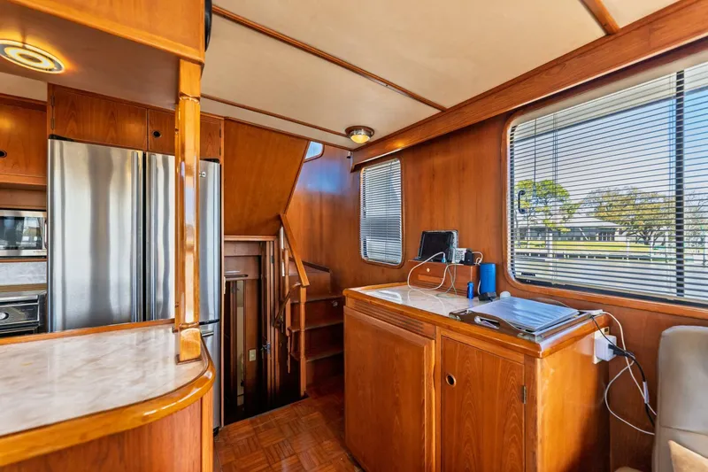 Slide: The Image of Interior of 1992 DeFever 49 Pilothouse with wood paneling and modern appliances. - 6