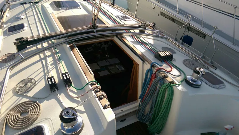 Slide: The Image of Jeanneau Sun Odyssey 45.2 sailboat deck, 2002 model, featuring rigging and open hatch. - 10