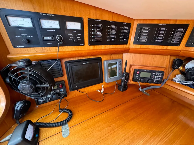 Slide: The Image of Control panel of 2002 Jeanneau Sun Odyssey 45.2 yacht with navigation and communication equipment. - 21