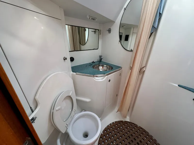 Slide: The Image of Bathroom interior of 2002 Jeanneau Sun Odyssey 45.2 yacht, featuring sink and toilet. - 29