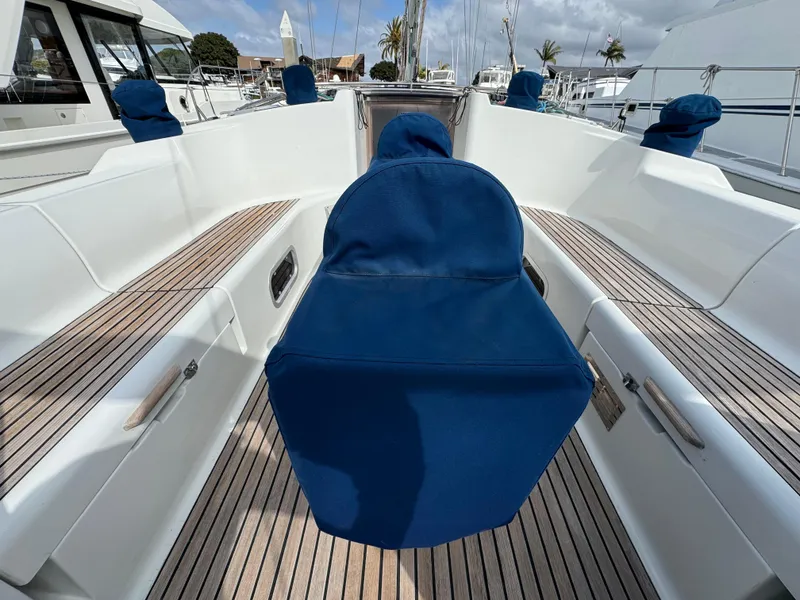 Slide: The Image of Cockpit of 2002 Jeanneau Sun Odyssey 45.2 sailboat with blue covers and teak decking. - 7