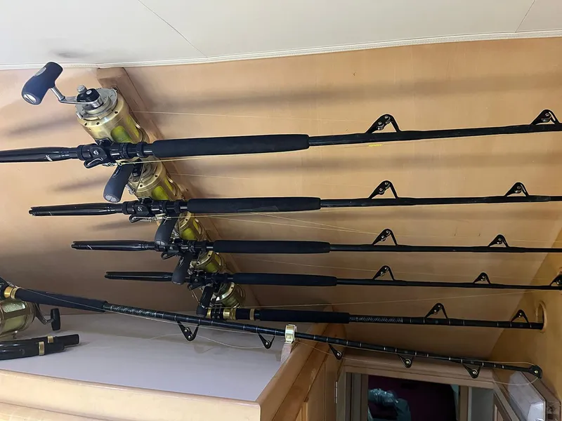 Slide: The Image of Fishing rods stored on a 1996 Hatteras 43 Convertible boat interior. - 21