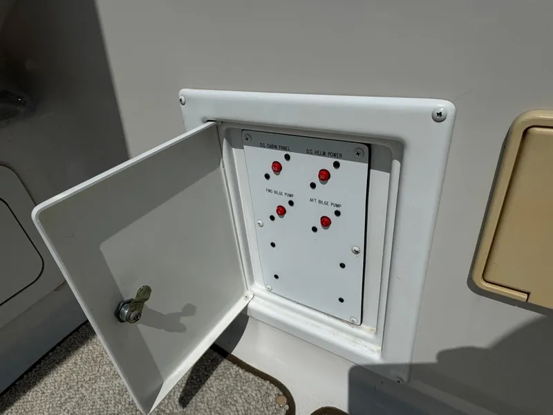 Slide: The Image of Control panel on a 2003 Crownline 262 CR boat with open access door. - 13