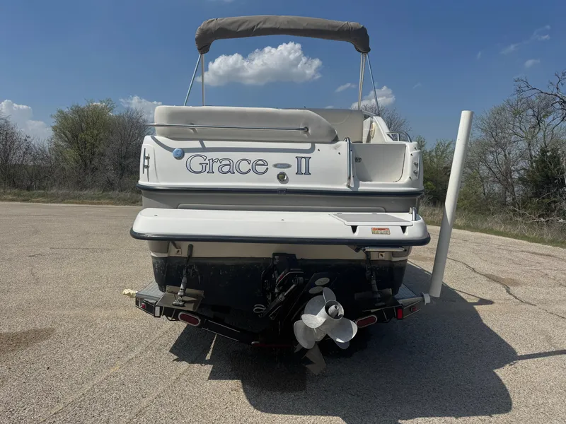 Slide: The Image of Rear view of 2003 Crownline 262 CR boat named "Grace II" on a sunny day. - 3