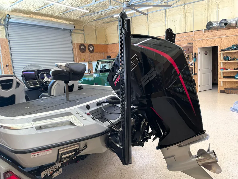 Slide: The Image of 2023 Ranger Z520R 55th Anniversary Limited Edition boat with powerful outboard motor in a garage. - 10