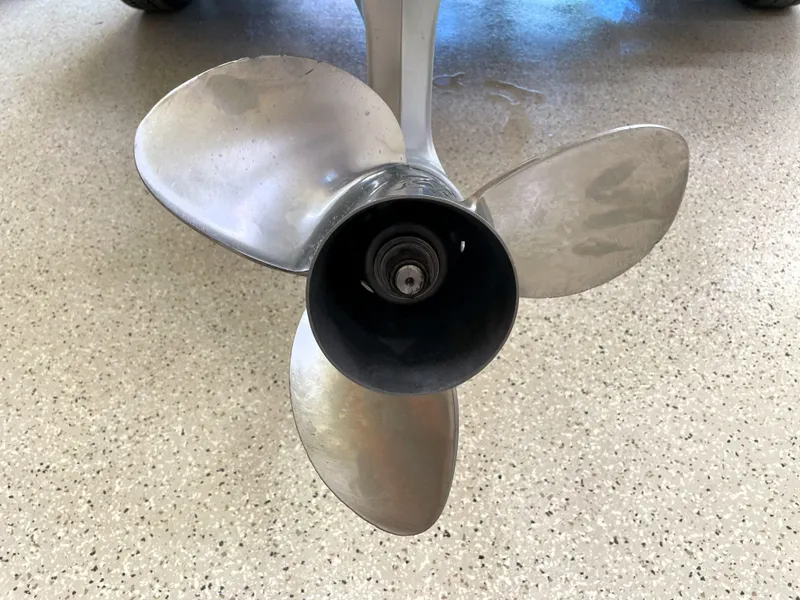 Slide: The Image of Propeller of 2023 Ranger Z520R 55th Anniversary Limited Edition boat on speckled floor. - 13