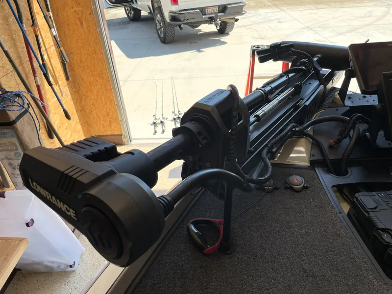 Slide: The Image of 2023 Ranger Z520R 55th Anniversary boat with Lowrance equipment in a garage setting. - 21