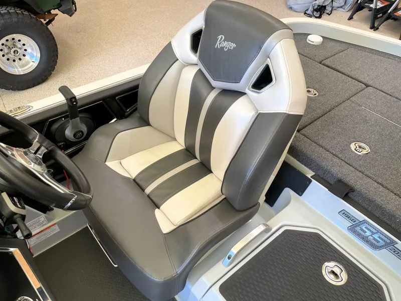Slide: The Image of 2023 Ranger Z520R 55th Anniversary boat seat, gray and white design, steering wheel visible. - 36