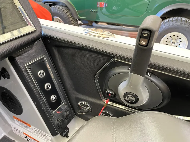 Slide: The Image of 2023 Ranger Z520R 55th Anniversary Limited Edition boat interior controls and dashboard. - 40