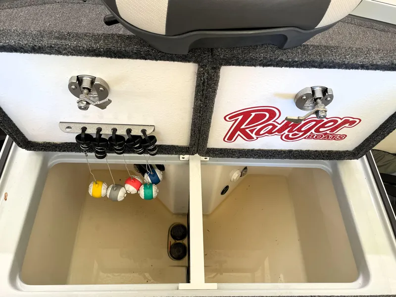Slide: The Image of 2023 Ranger Z520R 55th Anniversary boat storage compartment with colorful fishing bobbers. - 46