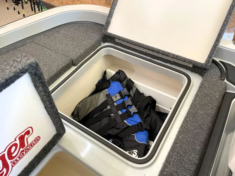 Slide: The Image of 2023 Ranger Z520R 55th Anniversary boat storage compartment with life jackets. - 47