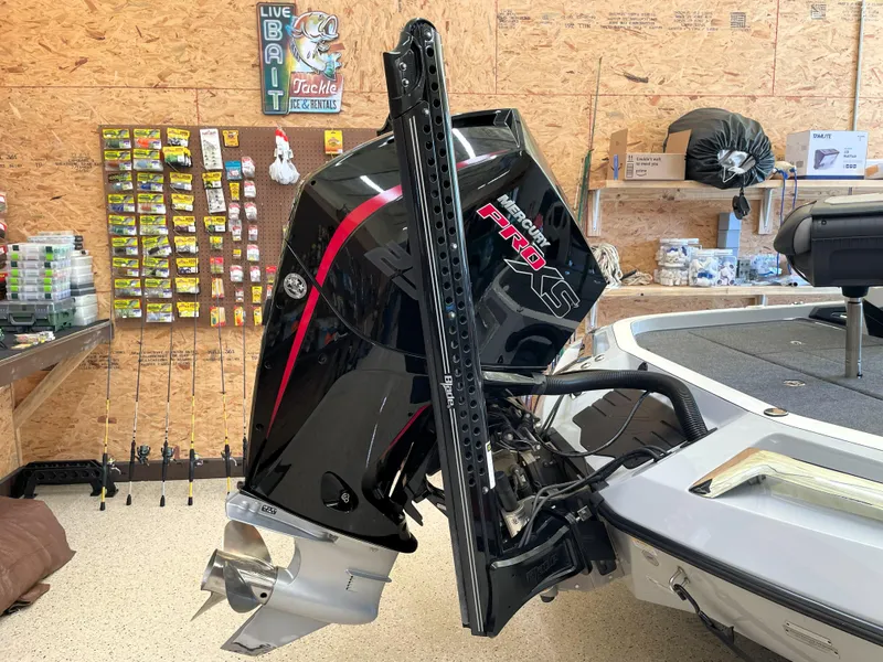 Slide: The Image of 2023 Ranger Z520R 55th Anniversary boat with powerful outboard motor in a fishing shop. - 9