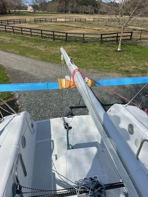 Slide: The Image of Sailboat deck view, Columbia 32 model, 2007, with mast and rigging, in a rural setting. - 14