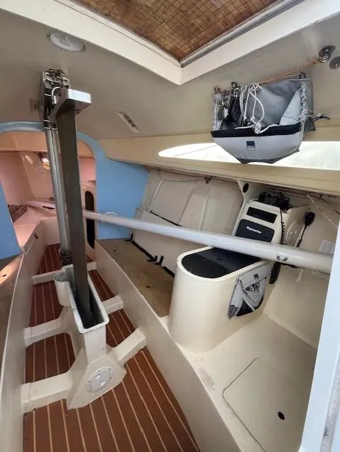 Slide: The Image of Interior of 2007 Columbia 32 sailboat, featuring seating and storage areas. - 16