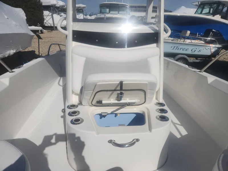 Slide: The Image of 2015 Boston Whaler 240 Dauntless boat interior with open storage compartment. - 10