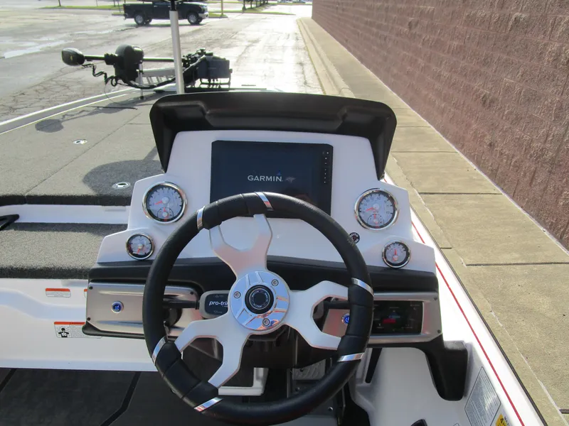 Slide: The Image of Nitro Z20 XL Pro 2025 boat dashboard with Garmin display and steering wheel. - 16