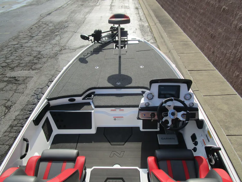 Slide: The Image of 2025 Nitro Z20 XL Pro boat interior with steering wheel and seating. - 18