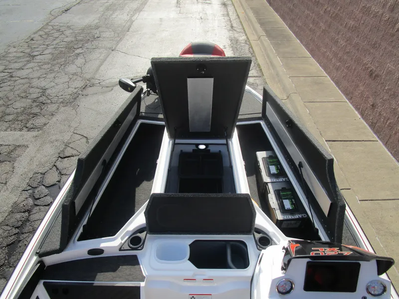 Slide: The Image of 2025 Nitro Z20 XL Pro boat interior with open storage compartments and batteries. - 19