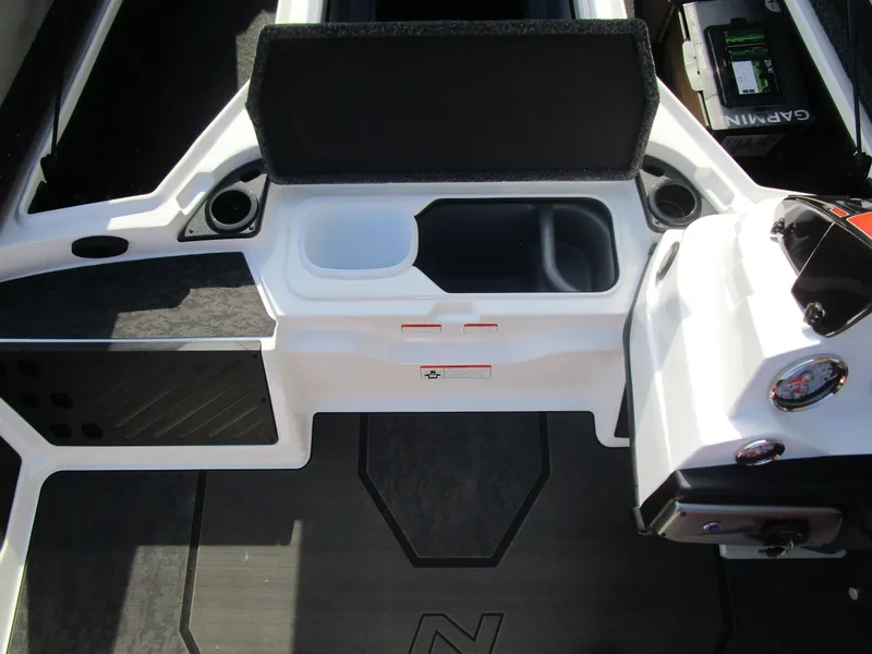Slide: The Image of 2025 Nitro Z20 XL Pro boat interior with storage compartments and Garmin electronics. - 20