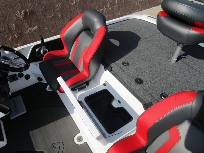 Slide: The Image of 2025 Nitro Z20 XL Pro boat interior with red and black seats and storage compartment. - 22