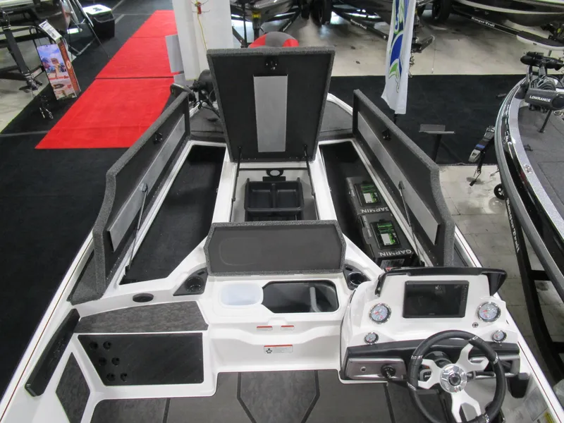Slide: The Image of 2025 Nitro Z20 boat interior with open storage compartments and modern dashboard. - 6