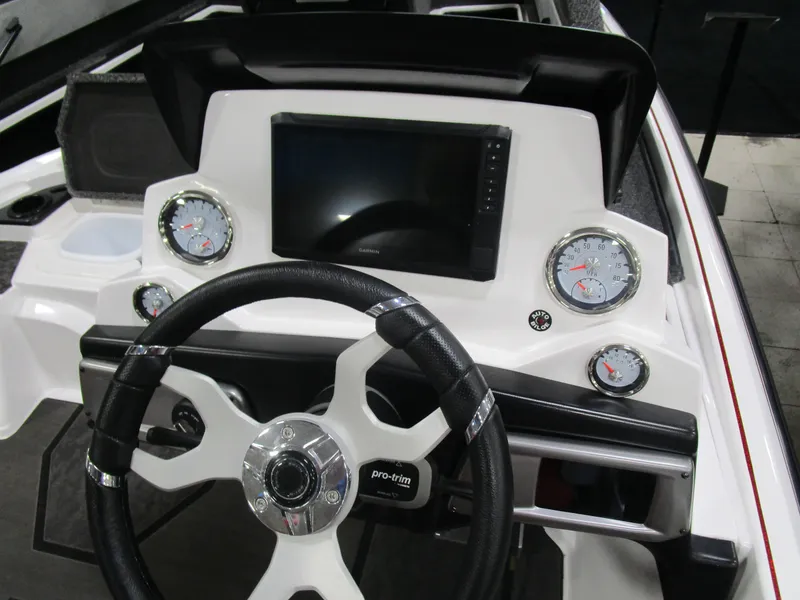 Slide: The Image of 2025 Nitro Z20 boat dashboard with steering wheel, gauges, and digital display. - 7