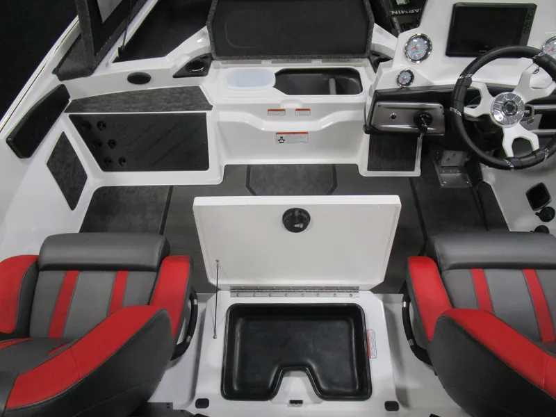Slide: The Image of 2025 Nitro Z20 boat interior with red and gray seats, steering wheel, and storage compartments. - 8