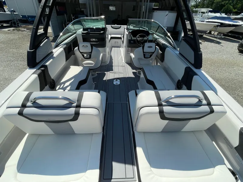 Slide: The Image of 2024 Chaparral 250 OSX boat interior with sleek seating and modern design. - 37
