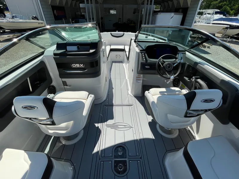 Slide: The Image of 2024 Chaparral 250 OSX boat interior with modern seating and sleek dashboard design. - 20