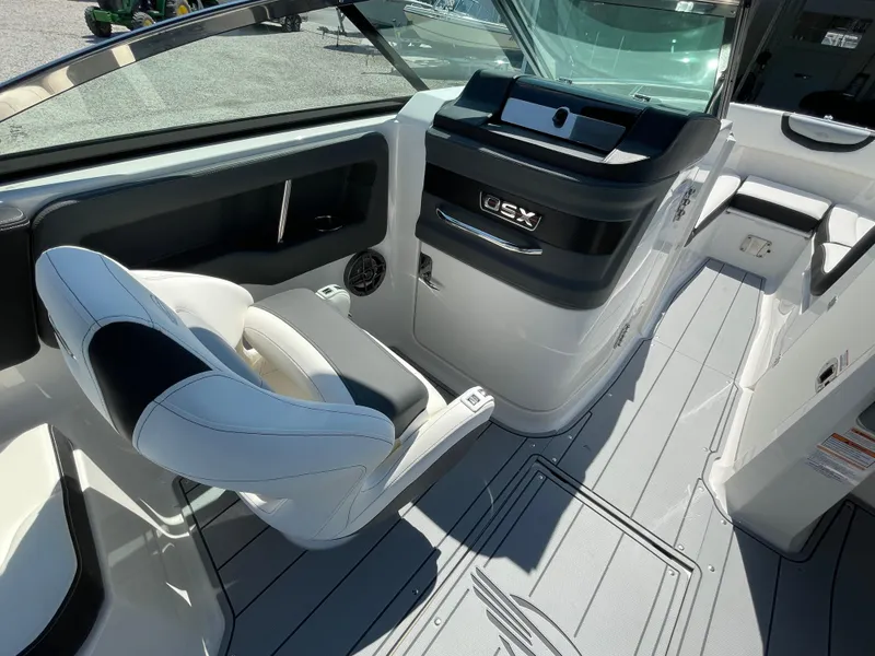 Slide: The Image of 2024 Chaparral 250 OSX boat interior with sleek seating and modern dashboard design. - 30