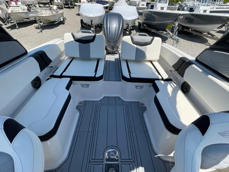 Slide: The Image of 2024 Chaparral 250 OSX boat interior with sleek seating and modern design. - 40