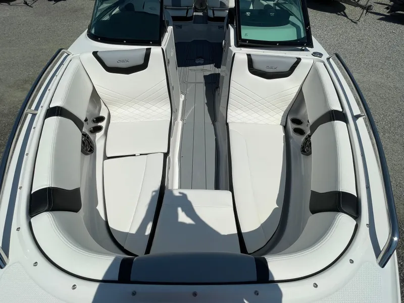 Slide: The Image of 2024 Chaparral 250 OSX boat interior with white seating and modern design. - 8
