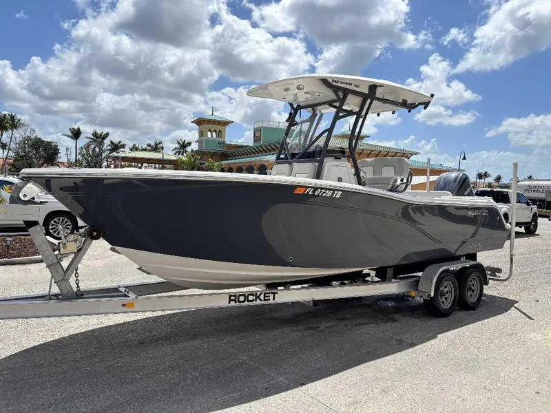 Slide: The Image of 2022 Sea Fox 248 Commander boat on trailer under a partly cloudy sky. - 10