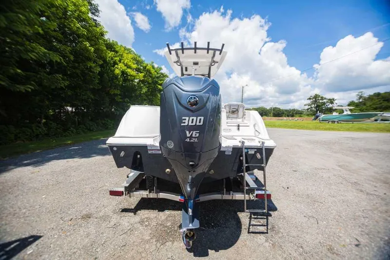Slide: The Image of 2022 Sea Fox 248 Commander boat with powerful 300 V6 engine, parked outdoors. - 3