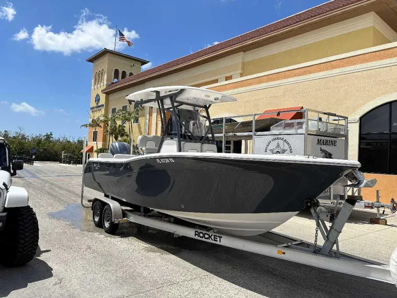 Slide: The Image of 2022 Sea Fox 248 Commander boat on trailer outside a marine dealership. - 7