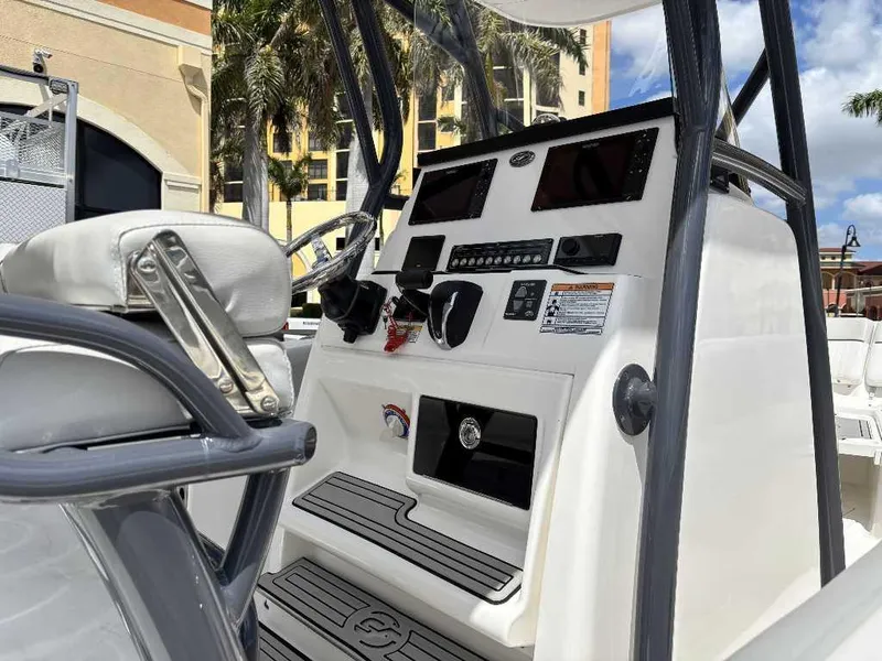 Slide: The Image of 2022 Sea Fox 248 Commander boat console with modern controls and seating. - 8