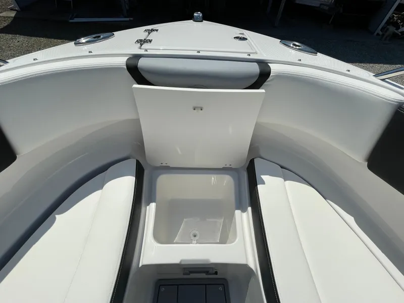 Slide: The Image of 2024 Chaparral 250 OSX boat interior with open storage compartment. - 15