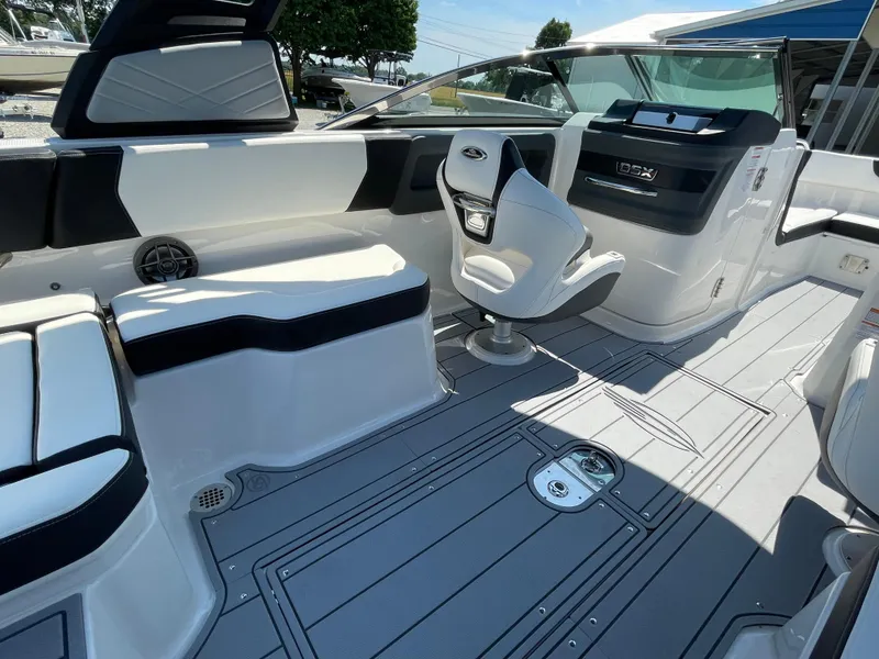 Slide: The Image of 2024 Chaparral 250 OSX boat interior with sleek seating and modern design. - 34