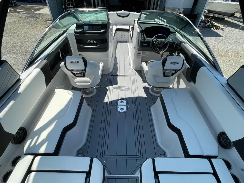 Slide: The Image of 2024 Chaparral 250 OSX boat interior with modern seating and sleek design. - 36