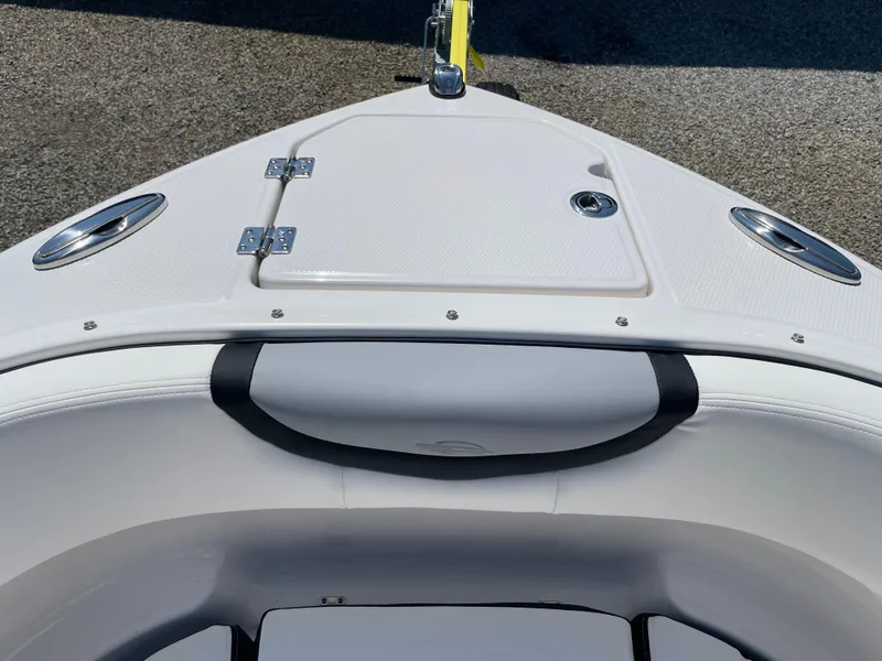 Slide: The Image of 2024 Chaparral 250 OSX boat bow with storage hatch and stainless steel fixtures. - 4