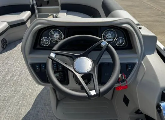 Slide: The Image of Steering console of 2025 South Bay 224FCR LE pontoon boat with modern gauges. - 5
